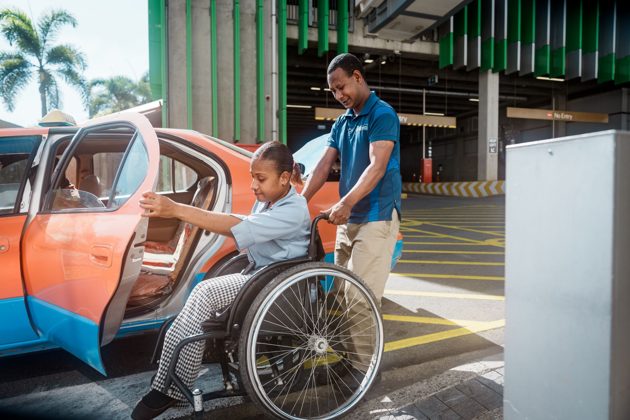 Even though she has a regular taxi driver, Kerry Kawowo often has to rely on standard transportation, which can be challenging for people with disabilities. Credit: GPE/Esteban Barrera