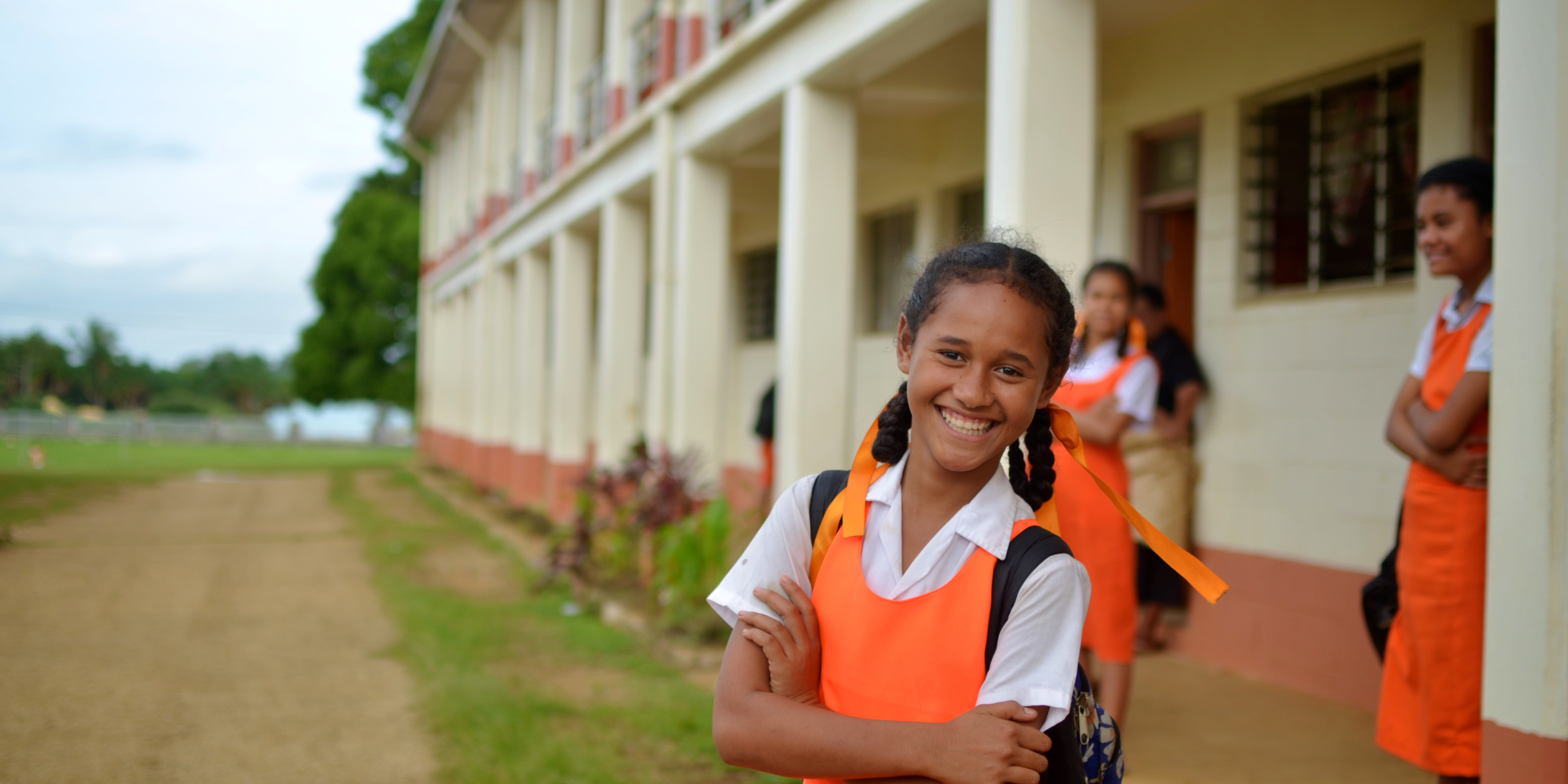 A girl outside her school. Credit: World Bank/Tom Perry
